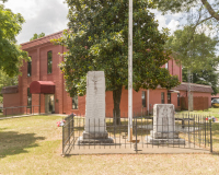 An image of the Fulton County Courthouse in Salem, Arkansas.  In the foreground are memorials to those from Fulton County who died during World War II and the Vietnam War.  The Salem courthouse was built as a Second Empire structure in 1891.  The brick Fulton County Courthouse was substantially remodeled in 1974.  This stock photo Copyright Capitolshots Photography, ALL RIGHTS RESERVED.