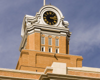 A photo of the clock tower of the Randall County Courthouse in Canyon, Texas.  Designed by R.G. Kirsch Co., the Canyon courthouse was completed in 1909.  The brick Texas Renaissance courthouse, the county’s second, is a Texas Historic Landmark.  Renovations to the exterior of the Randall County Courthouse, which included the restoration of the clock tower, were completed in 2010.  This photo © Capitolshots Photography/TwoFiftyFour Photos, LLC, ALL RIGHTS RESERVED.