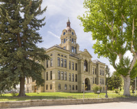 A photo of the Deer Lodge County Courthouse in Anaconda, Montana.  Designed by Bell And Kent, the Anaconda courthouse was built in 1898.  The sandstone Deer Lodge County Courthouse, a Classical Revival structure, is part of the Butte-Anaconda Historic District, which is a National Historic Landmark.  This photo © Capitolshots Photography/TwoFiftyFour Photos, LLC, ALL RIGHTS RESERVED.