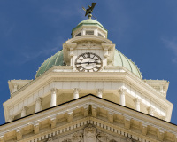 An image of the clock tower of the Giles County Courthouse in Pulaski, Tennessee.  Designed by Benjamin N. Smith, the Pulaski courthouse was constructed in 1909.  The brick Giles County Courthouse, a Classical Revival structure, is part of the Pulaski Courthouse Square Historic District, which is listed on the National Register of Historic Places.  This image © Capitolshots Photography/TwoFiftyFour Photos, LLC, ALL RIGHTS RESERVED.